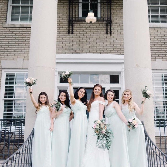 bride in Sophie earrings with her bridesmaids