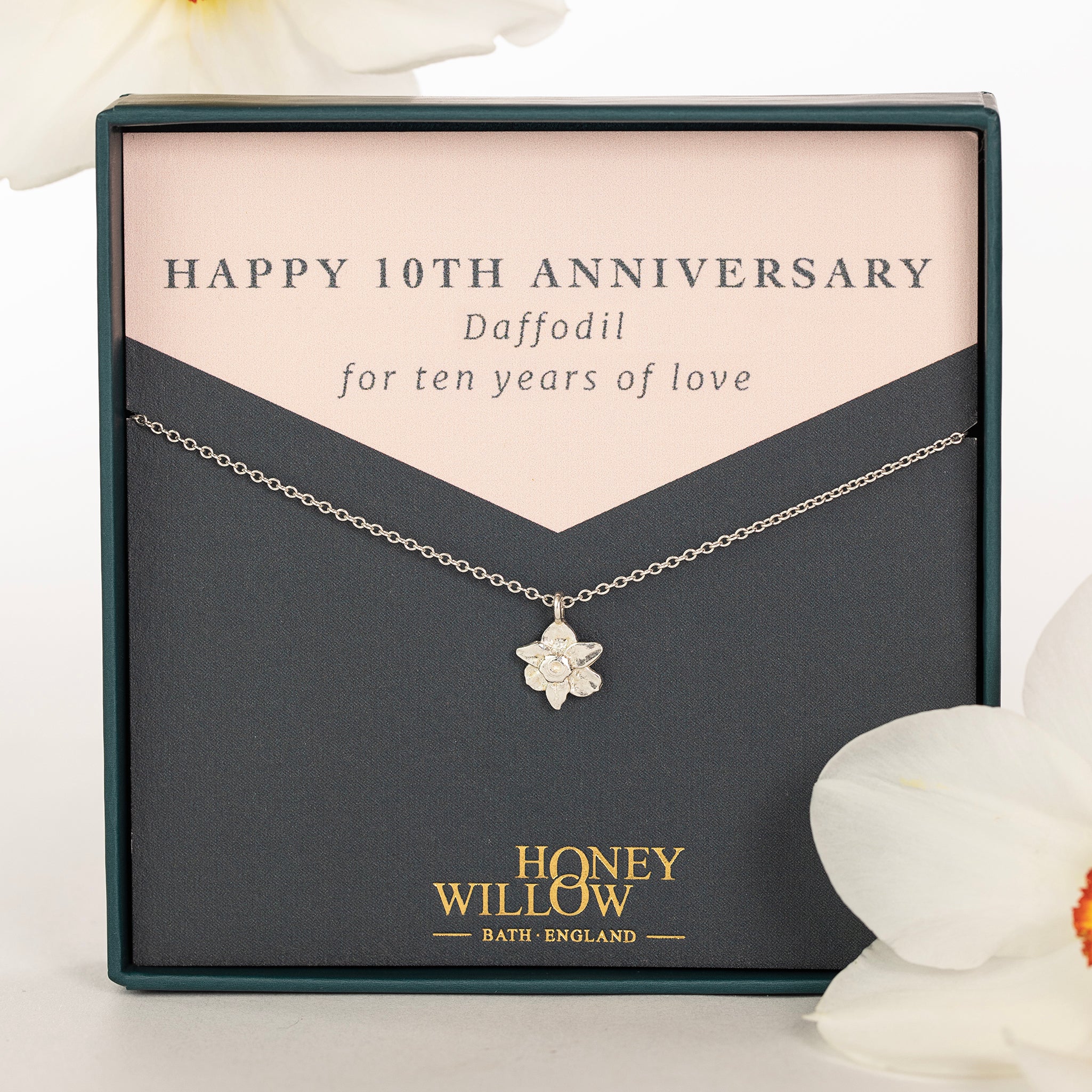 Silver daffodil flower necklace presented as a tenth anniversary gift
