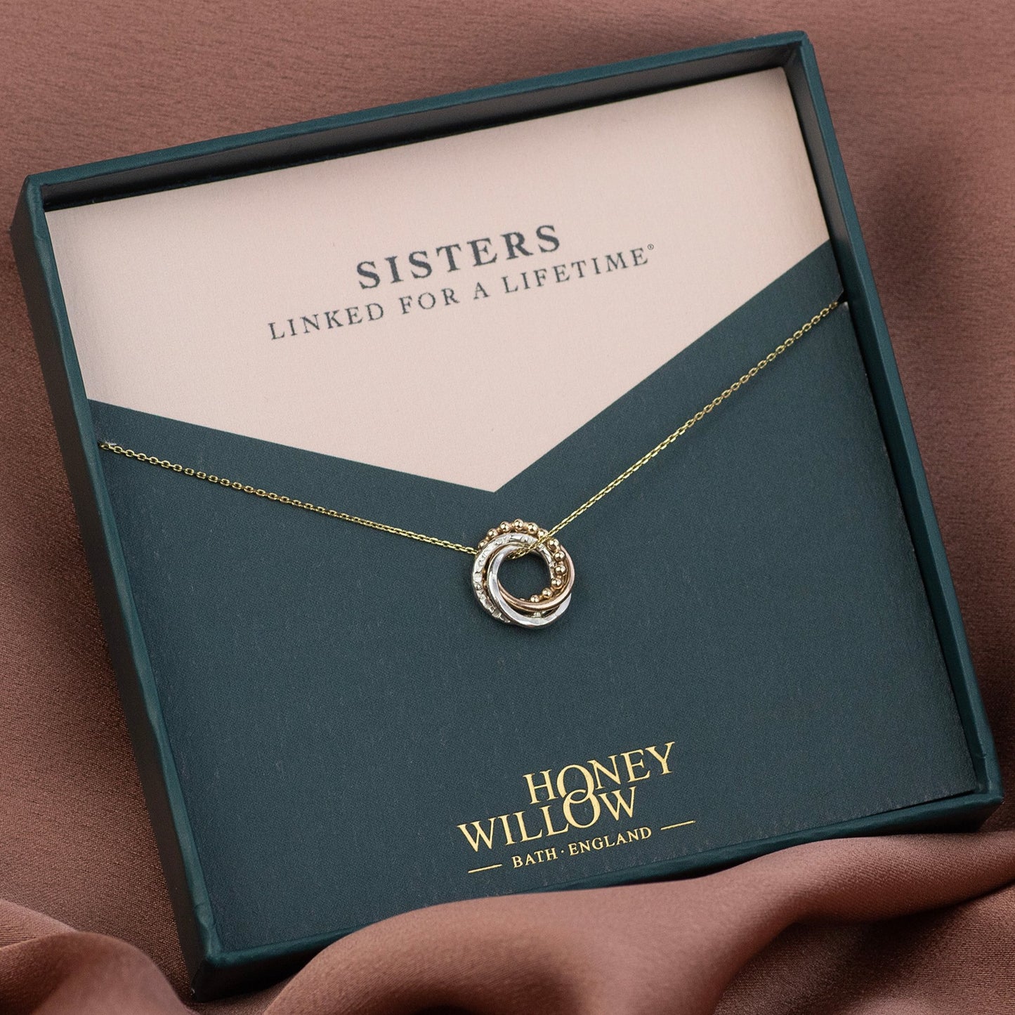 4 Sisters Necklace - 9kt Gold & Silver Love Knot