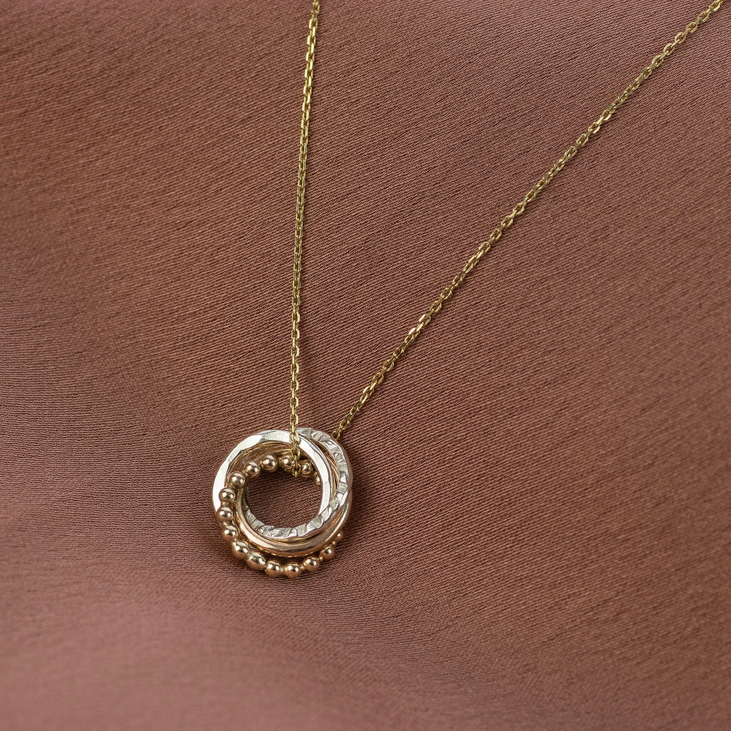 4 Sisters Necklace - 9kt Gold & Silver Love Knot