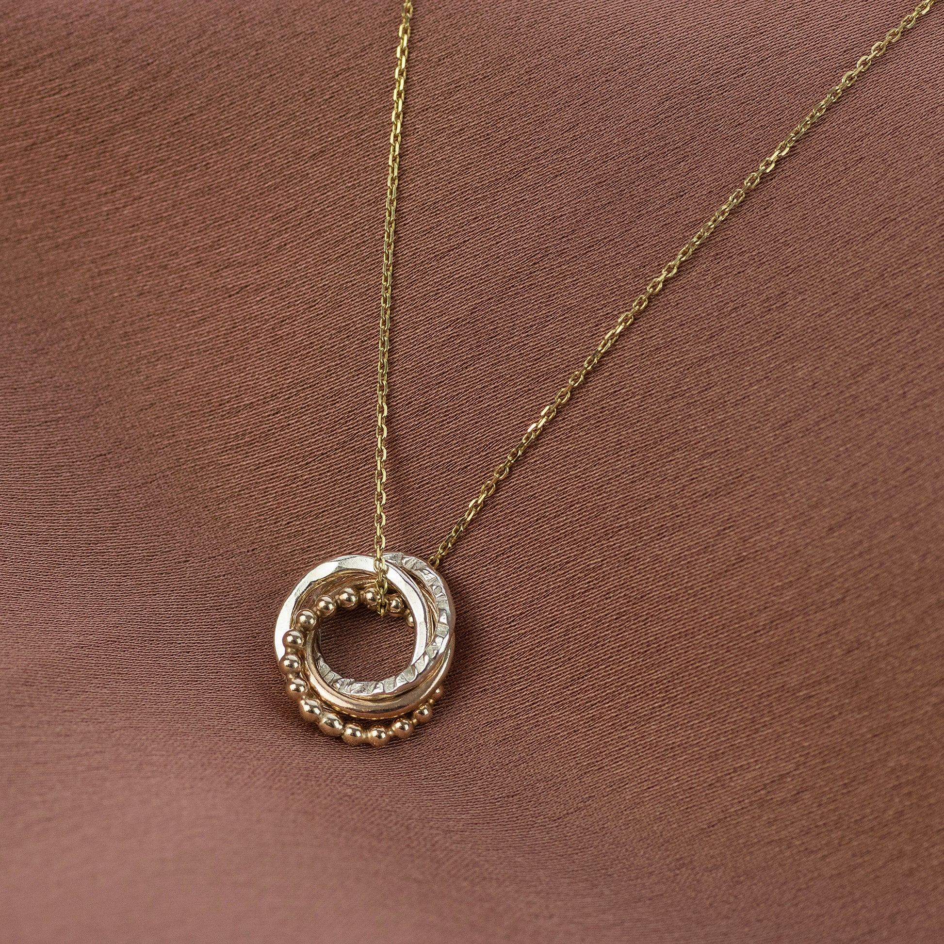4 Sisters Necklace - 9kt Gold & Silver Love Knot