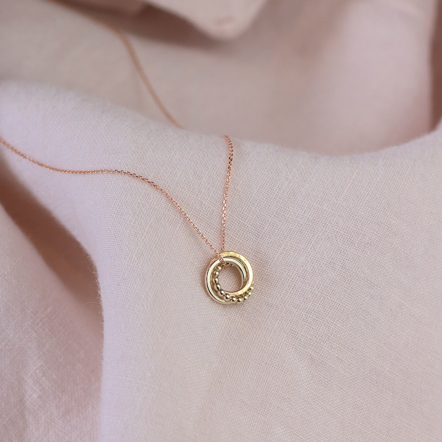 Tiny 9kt 3rd Anniversary Love Knot Necklace - White Rose Yellow Gold